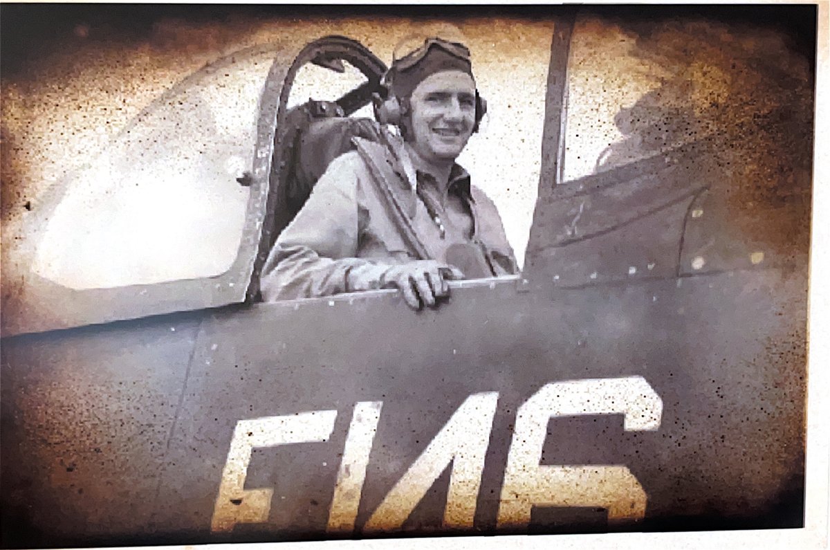 Bill Brooks smiling in the cockpit of his aircraft